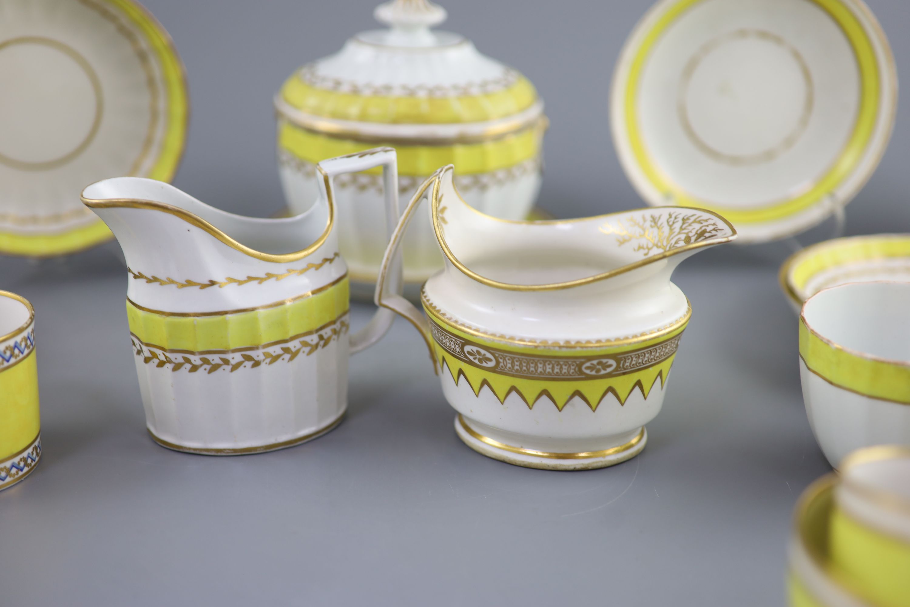 A group of Derby yellow ground tea and coffee wares and a chamberstick, c.1790-1800